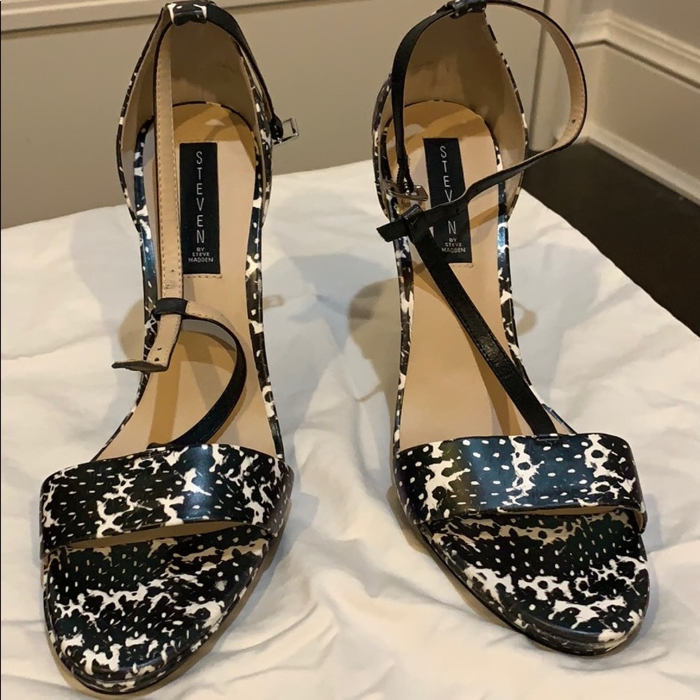 Back and white high heeled sandals